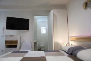 Postel nebo postele na pokoji v ubytování Civico Sedici Suite & Spa