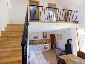 a view of a living room and kitchen with a staircase at Holiday Home Jure by Interhome in Mrljane