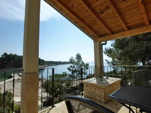 a patio with a view of the water at Holiday Home Jure by Interhome in Mrljane +17 photos