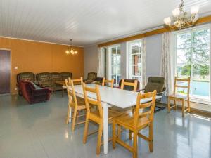 a dining room with a table and chairs at Holiday Home Kylämattila by Interhome in Ilola
