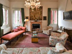 a living room with a couch and a fireplace at Villa Barchessa Palladio by Interhome in Levada