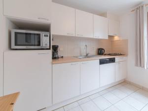 Kuchyň nebo kuchyňský kout v ubytování Holiday Home Vissershuisje 9-21 by Interhome + 10 fotografií