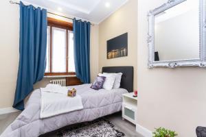 מיטה או מיטות בחדר ב-Exclusive Room Arena Inalpi 'La casa di Bertino'