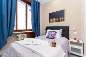 Postel nebo postele na pokoji v ubytování Exclusive Room Arena Inalpi 'La casa di Bertino'