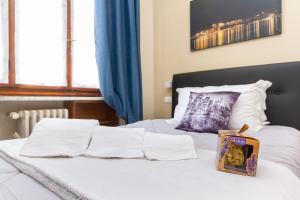 מיטה או מיטות בחדר ב-Exclusive Room Arena Inalpi 'La casa di Bertino'