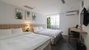 Postel nebo postele na pokoji v ubytování Hotel attic