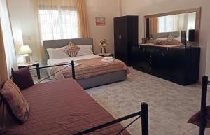 Posteľ alebo postele v izbe v ubytovaní Villa Ekali