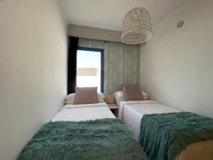 Łóżko lub łóżka w pokoju w obiekcie Villa Gaumet by Villalia