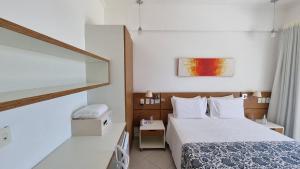 Cama ou camas em um quarto em Juquei Frente ao Mar Hotel Pousada