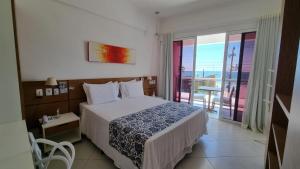Cama ou camas em um quarto em Juquei Frente ao Mar Hotel Pousada