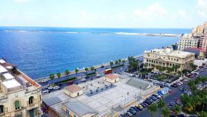 an aerial view of a city with the ocean at Hyde Park House Hotel in Alexandria