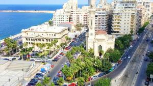 an aerial view of a city with a road and buildings at Hyde Park House Hotel in Alexandria