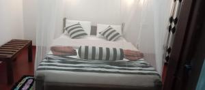 Postel nebo postele na pokoji v ubytování Nethanya Homestay
