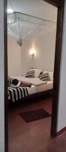 Postel nebo postele na pokoji v ubytování Nethanya Homestay + 12 fotografií