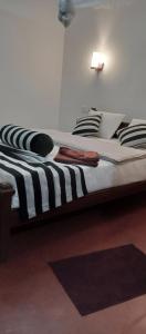 Postel nebo postele na pokoji v ubytování Nethanya Homestay