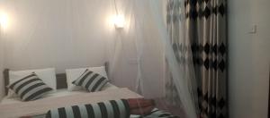 Postel nebo postele na pokoji v ubytování Nethanya Homestay