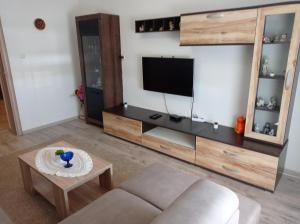 a living room with a couch and a flat screen tv at Mimi in Šibenik