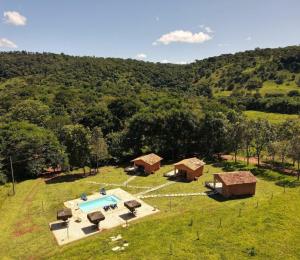 an aerial view of a farm with a pool and buildings at Quinta do Vale in Pirenópolis