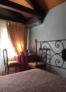 Postel nebo postele na pokoji v ubytování Suite Attico con Altana