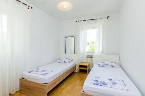 Posteľ alebo postele v izbe v ubytovaní Apartments Dubrovnik Airport