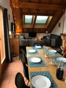 a long table with plates and wine glasses on it at Chal'Oz 4 stars in Oz