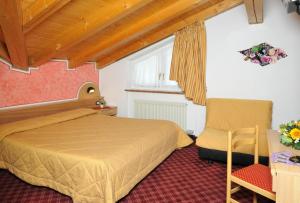 Säng eller sängar i ett rum på Hotel Ristorante Milano