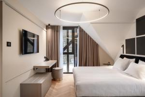 Un pat sau paturi într-o cameră la Hotel Čad