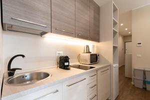 A kitchen or kitchenette at Via Torino Apartment 2