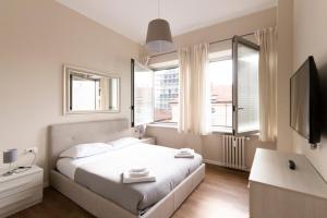 Voodi või voodid majutusasutuse Via Torino Apartment 2 toas