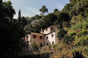 a house on the side of a hill at LEremoRifugio escursionistico10 min steep walk in Portofino