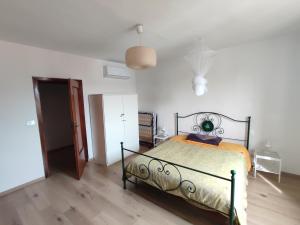 Postel nebo postele na pokoji v ubytování Il grazioso appartamento di Chiara con posto auto privato