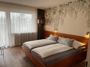 Postel nebo postele na pokoji v ubytování Hotel Gästehaus Zürn
