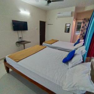 Postel nebo postele na pokoji v ubytování Green Apple Resorts