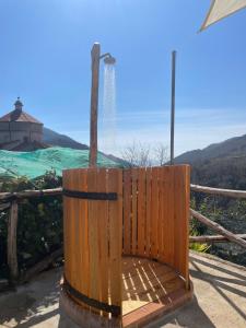 a wooden bench sitting on top of a mountain at Pucaré Apartments in Tramonti