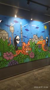 a wall with a mural of a cat and a fish at 1130 Wojciechowskiego 6A - Tanie Pokoje w Apartamencie - samodzielne zameldowanie in Poznań