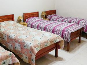 A bed or beds in a room at Tierra Nuestra