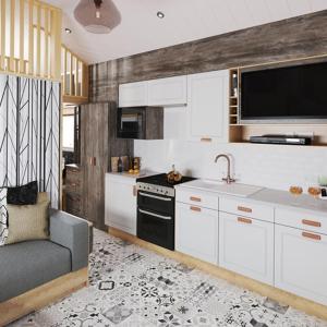 una cucina con armadi bianchi, lavandino e divano di The Willy Gunn Pod - Beautiful, luxury pod ad Aberlour