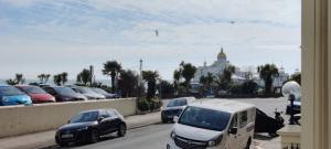 a group of cars parked in a parking lot at 6 Queens Gardens in Eastbourne