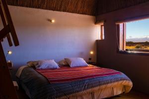 Postel nebo postele na pokoji v ubytování Planeta Atacama Lodge