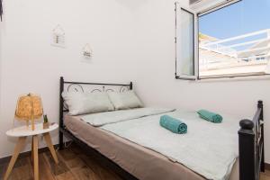 Postel nebo postele na pokoji v ubytování Apartments Lumini