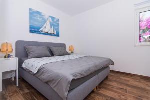 Postel nebo postele na pokoji v ubytování Apartments Lumini