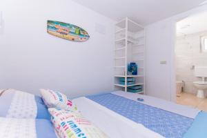 Postel nebo postele na pokoji v ubytování Apartments Lumini
