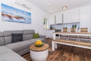 Kuchyň nebo kuchyňský kout v ubytování Apartments Lumini