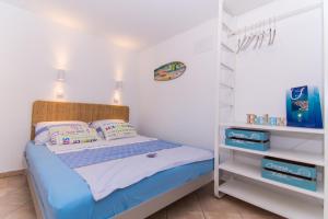 Postel nebo postele na pokoji v ubytování Apartments Lumini