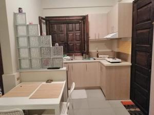 A kitchen or kitchenette at Small Sunset View apartment