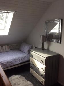Postel nebo postele na pokoji v ubytování Le Boterff Gites et Camping