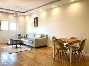 a living room with a couch and a table at M & A Apartment Bar A 29 in Bar