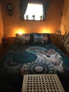 Tempat tidur dalam kamar di Gîtanneke