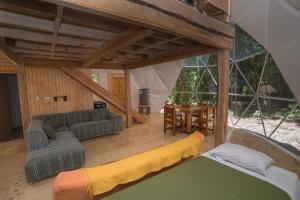 a living room with a couch and a table at Cabañas Ensenada Bosque Nativo in Ensenada +123 photos