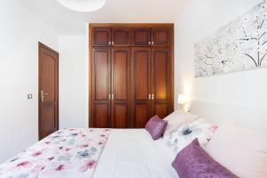 Postel nebo postele na pokoji v ubytování Home2Book Charming Apartment in Bajamar